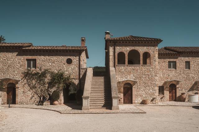 Stone borgo with staircase and arched doorways in Umbria, Italy — historic wedding venue